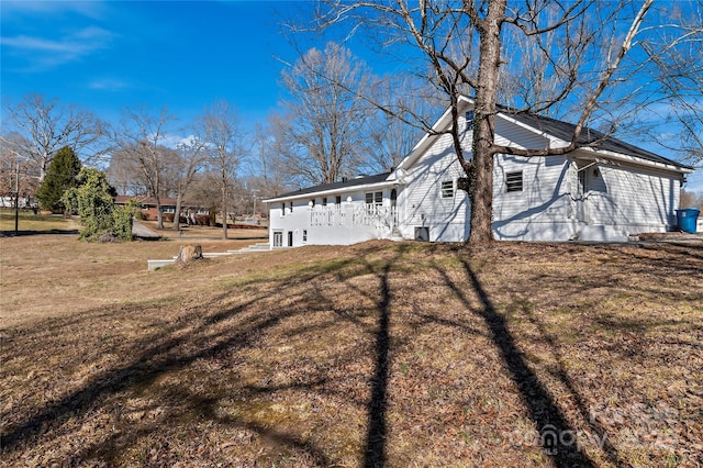view of home's exterior featuring a yard