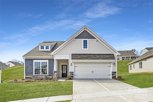 view of front of house featuring driveway, a garage, stone siding, a front lawn, and board and batten siding