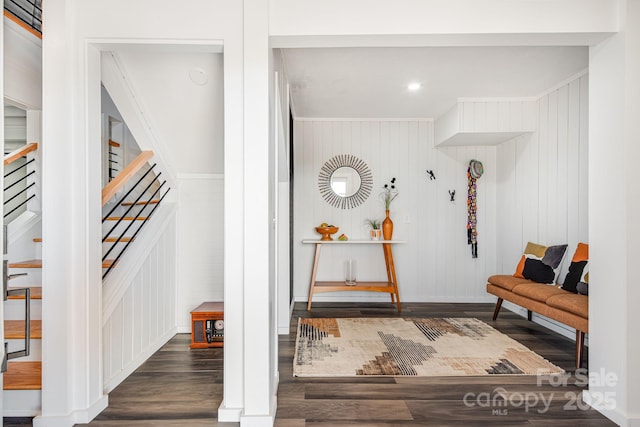 interior space featuring dark wood-style floors, stairs, and baseboards