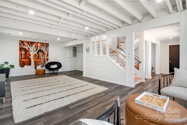 interior space with beamed ceiling, stairway, and dark wood-style flooring