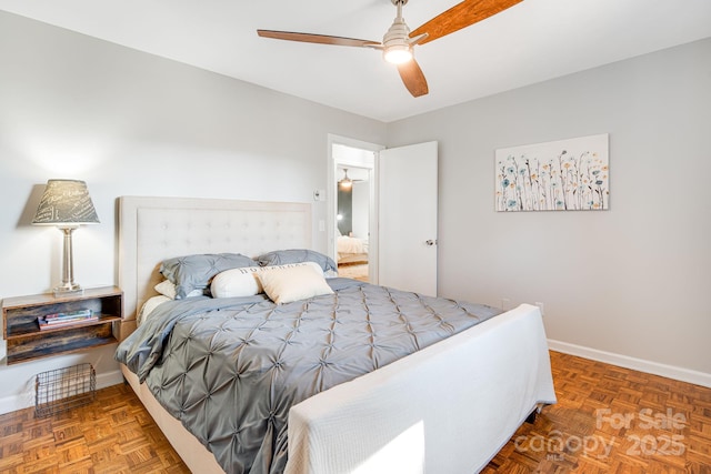 bedroom featuring ceiling fan and baseboards