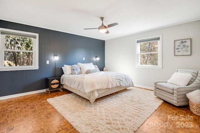 bedroom featuring crown molding, ceiling fan, and baseboards