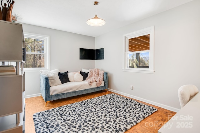 living area featuring baseboards