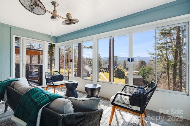 sunroom with a mountain view