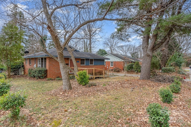 rear view of property with a yard