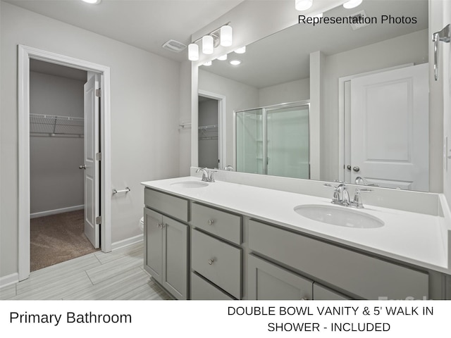 bathroom with vanity and walk in shower