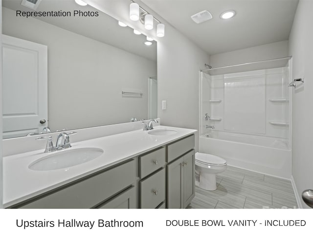 full bathroom with vanity, toilet, and shower / bathing tub combination