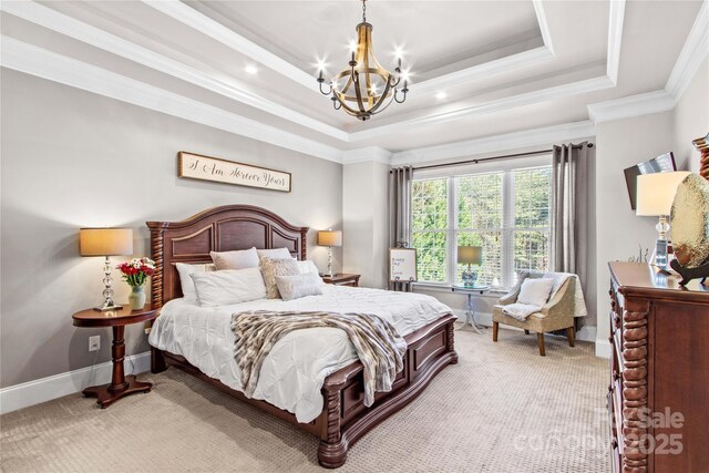 bedroom with light carpet, a tray ceiling, ornamental molding, and baseboards