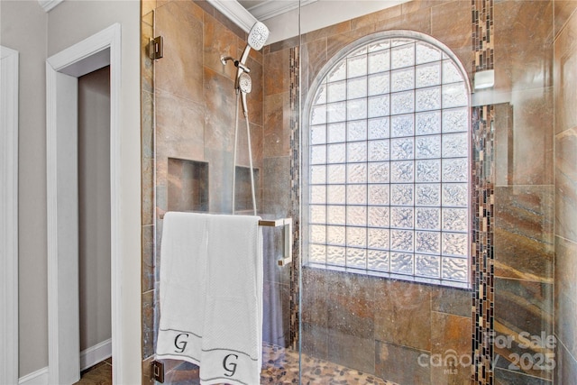 full bathroom with a shower stall and ornamental molding