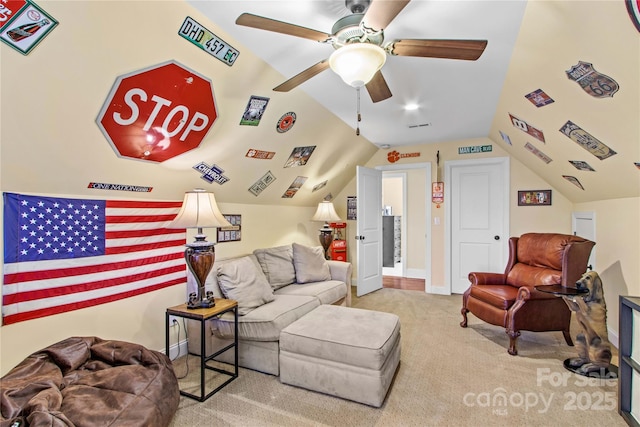 living room featuring lofted ceiling, light carpet, and a ceiling fan