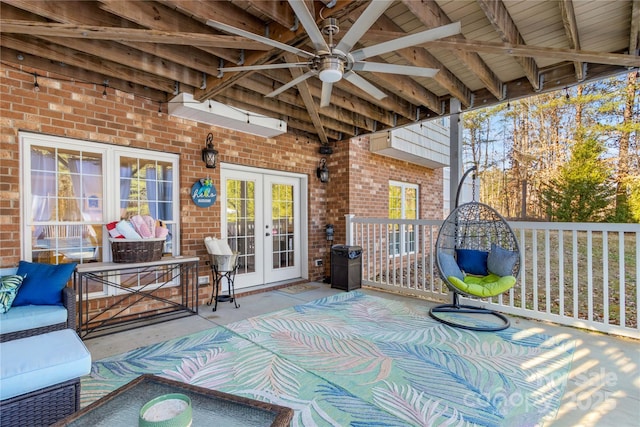 view of patio / terrace featuring ceiling fan, an outdoor hangout area, and french doors