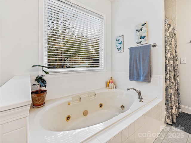 bathroom featuring tile patterned floors and tiled tub