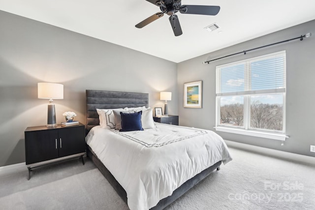 bedroom featuring light colored carpet and ceiling fan