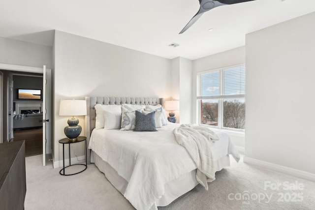 carpeted bedroom with ceiling fan