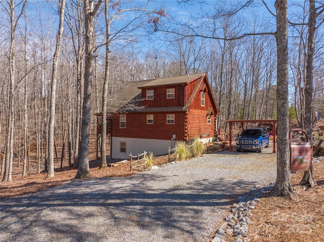view of side of property with a carport