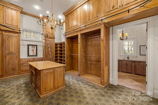 2725 Windsor Rd, Winston Salem, NC 27104 - spacious closet with a chandelier, a sink, and dark colored carpet