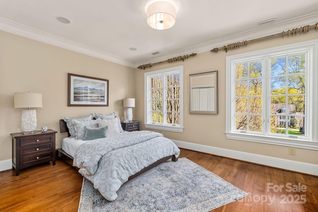 2725 Windsor Rd, Winston Salem, NC 27104 - bedroom featuring baseboards, multiple windows, crown molding, and wood finished floors