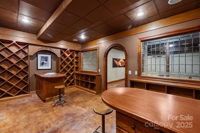 2725 Windsor Rd, Winston Salem, NC 27104 - wine cellar featuring arched walkways, baseboards, and concrete flooring