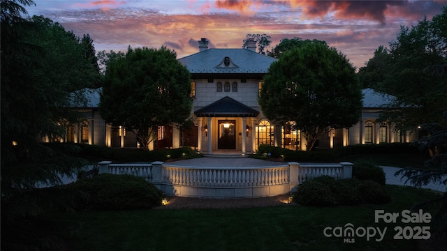 2725 Windsor Rd, Winston Salem, NC 27104 - back of property at dusk with a chimney and a lawn