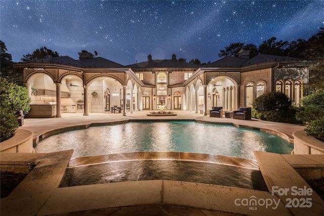 2725 Windsor Rd, Winston Salem, NC 27104 - pool at night with a patio and an outdoor pool