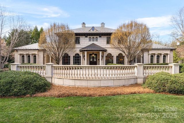 2725 Windsor Rd, Winston Salem, NC 27104 - rear view of property featuring a chimney, stone siding, and a lawn
