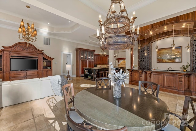 2725 Windsor Rd, Winston Salem, NC 27104 - dining area with a chandelier, crown molding, a tray ceiling, stone tile floors, and baseboards