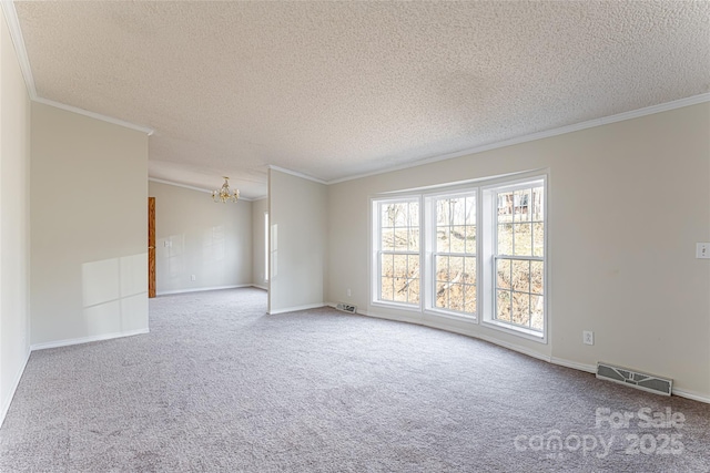 unfurnished room featuring ornamental molding, carpet floors, and a textured ceiling