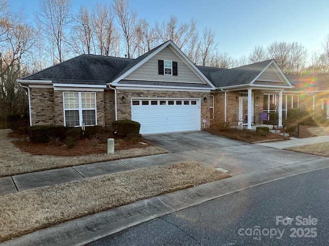 view of front of house with a garage and a porch