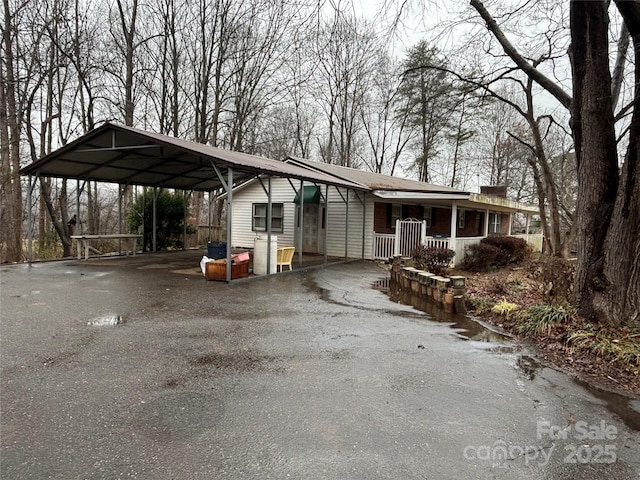 view of front facade featuring a carport and covered porch