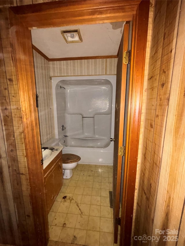 full bathroom featuring bathtub / shower combination, ornamental molding, vanity, and toilet