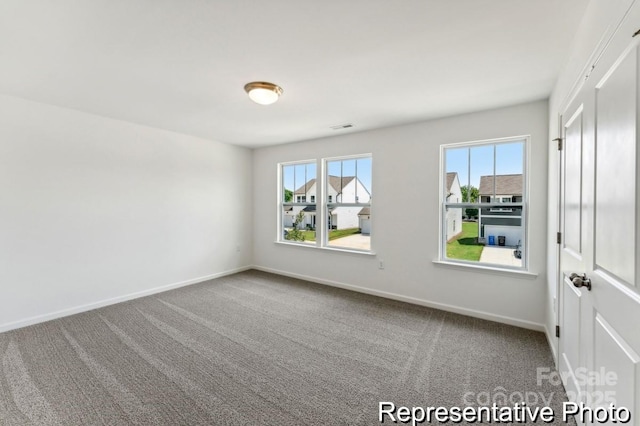 view of carpeted spare room