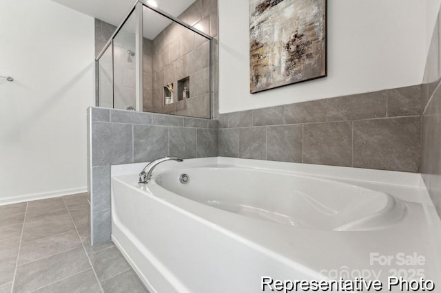 bathroom with tile patterned flooring and plus walk in shower