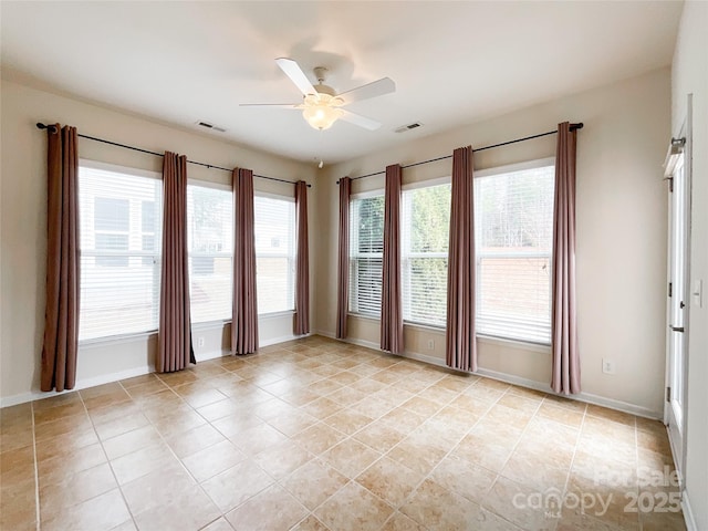 unfurnished room featuring ceiling fan