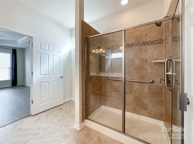 bathroom featuring a shower with door