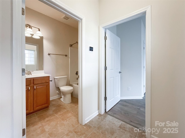 full bathroom with vanity, washtub / shower combination, and toilet