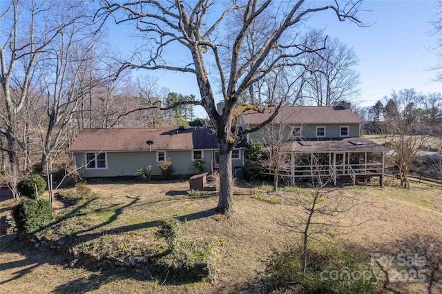 back of property featuring a chimney