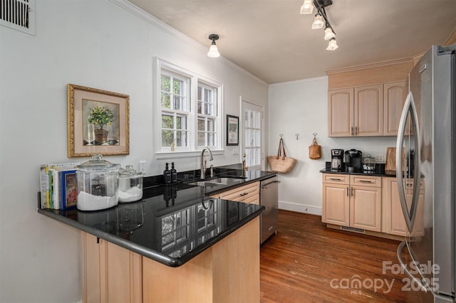 kitchen featuring kitchen peninsula, stainless steel appliances, dark hardwood / wood-style floors, sink, and light brown cabinetry