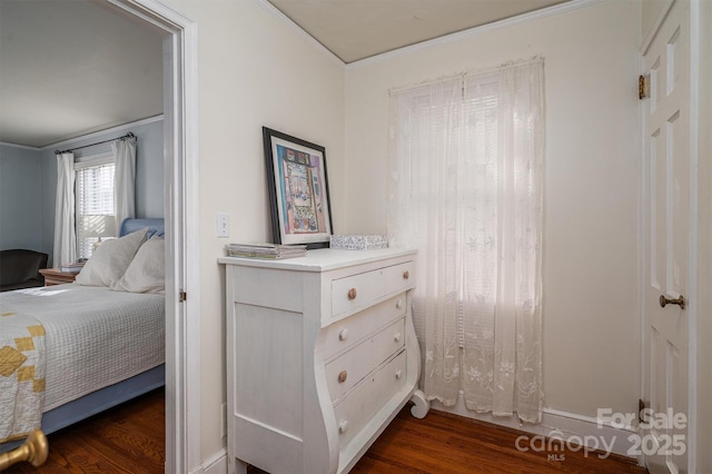 bedroom featuring dark hardwood / wood-style flooring and crown molding