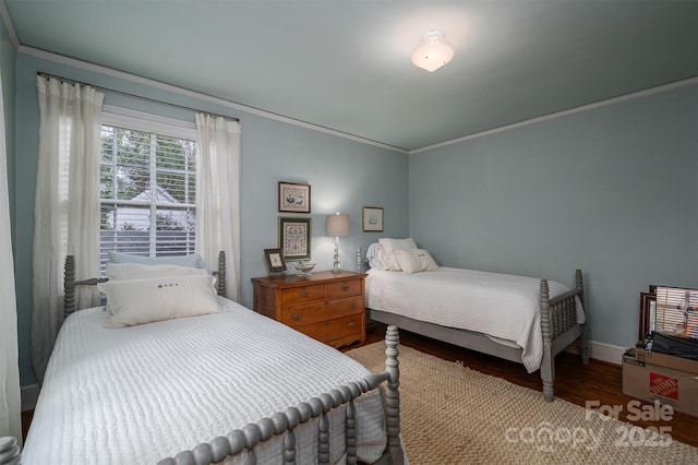 bedroom with hardwood / wood-style floors and crown molding