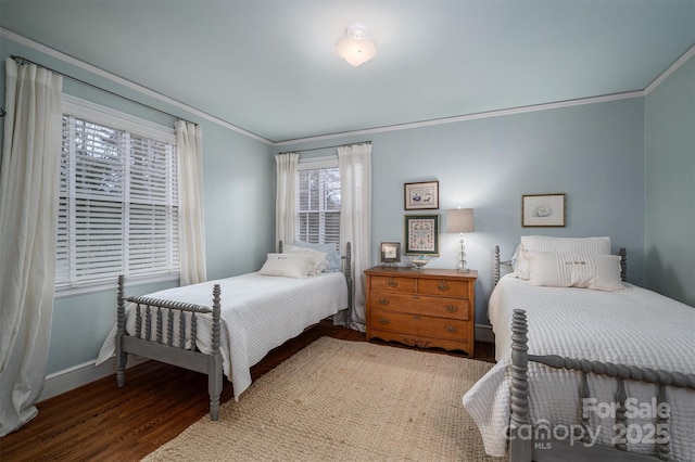 bedroom with dark wood-type flooring and crown molding