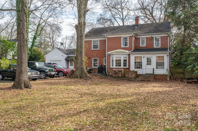 view of front of house featuring a front lawn and a garage