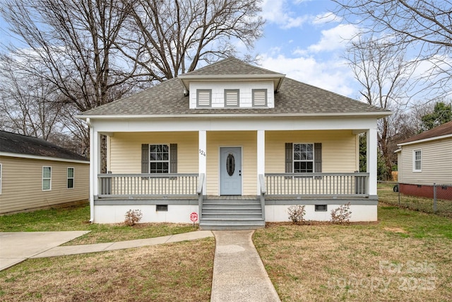 bungalow-style house with a porch and a front lawn