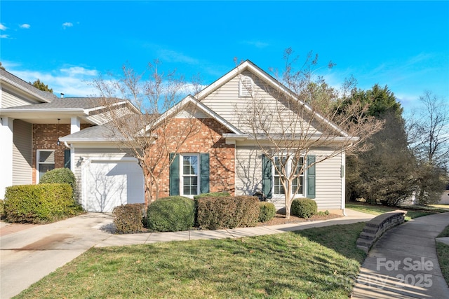 view of front of property with a garage and a front lawn