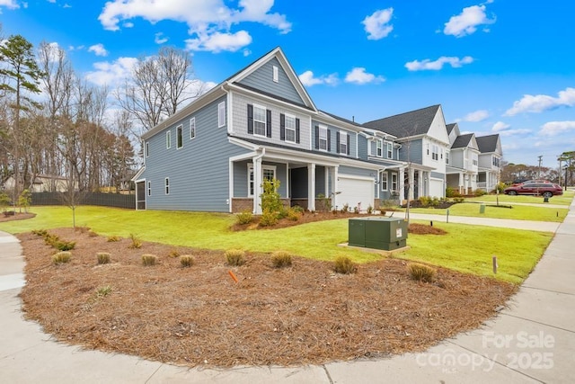 view of front of house with a front yard and a garage