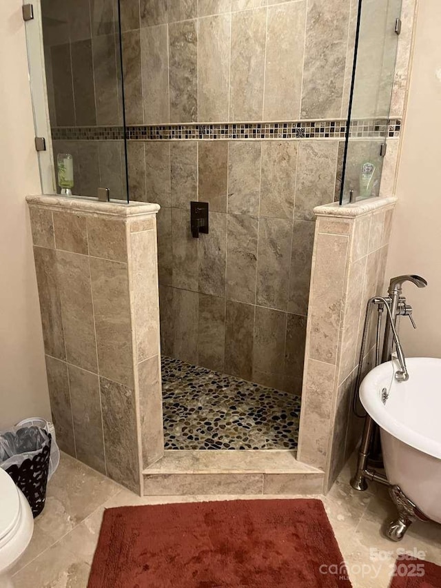 bathroom featuring separate shower and tub