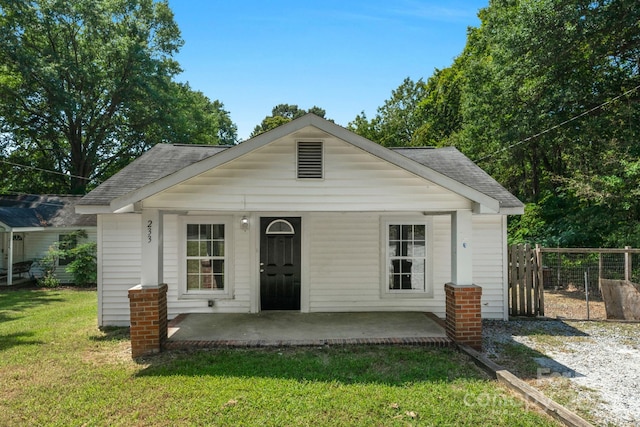 bungalow with a patio and a front yard