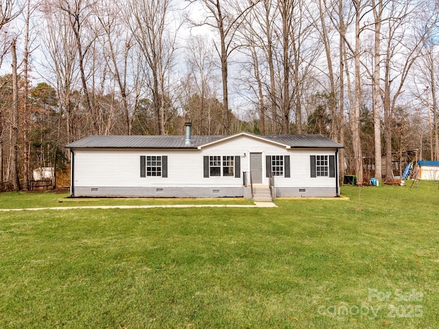 back of house with a yard