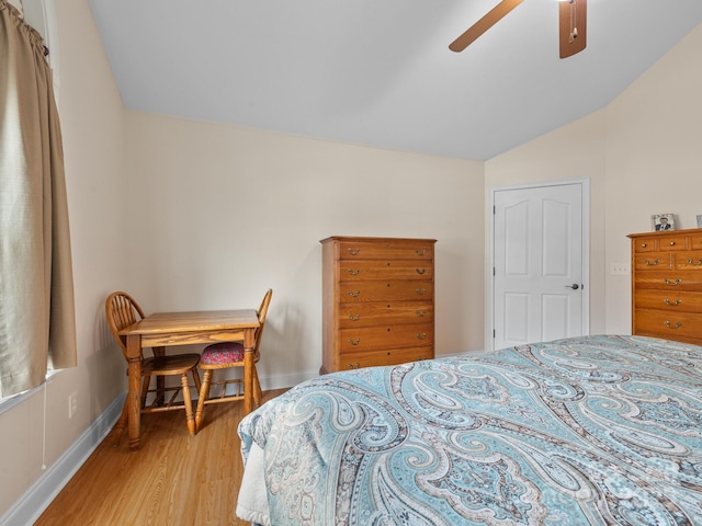 bedroom with lofted ceiling, wood-type flooring, and ceiling fan