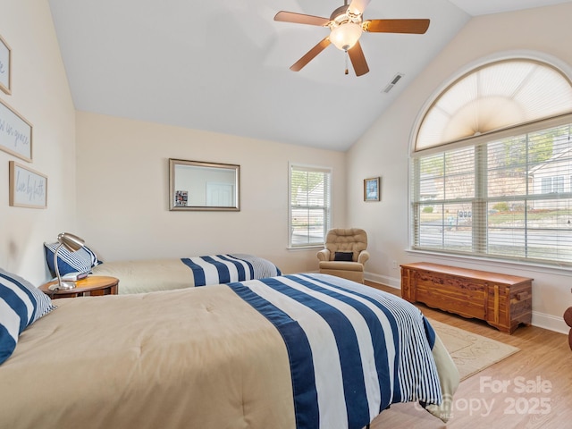 bedroom featuring vaulted ceiling, ceiling fan, and light wood-type flooring