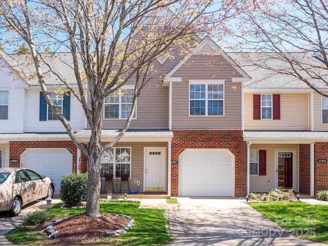 11907 Maria Ester Ct, Charlotte, NC 28277 - townhome / multi-family property featuring an attached garage, brick siding, and concrete driveway